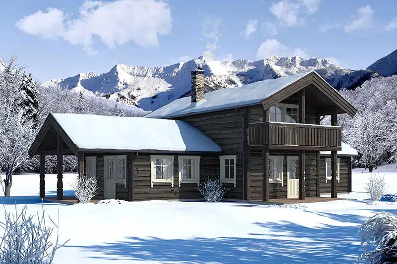 Hytte med snø på taket og på bakken